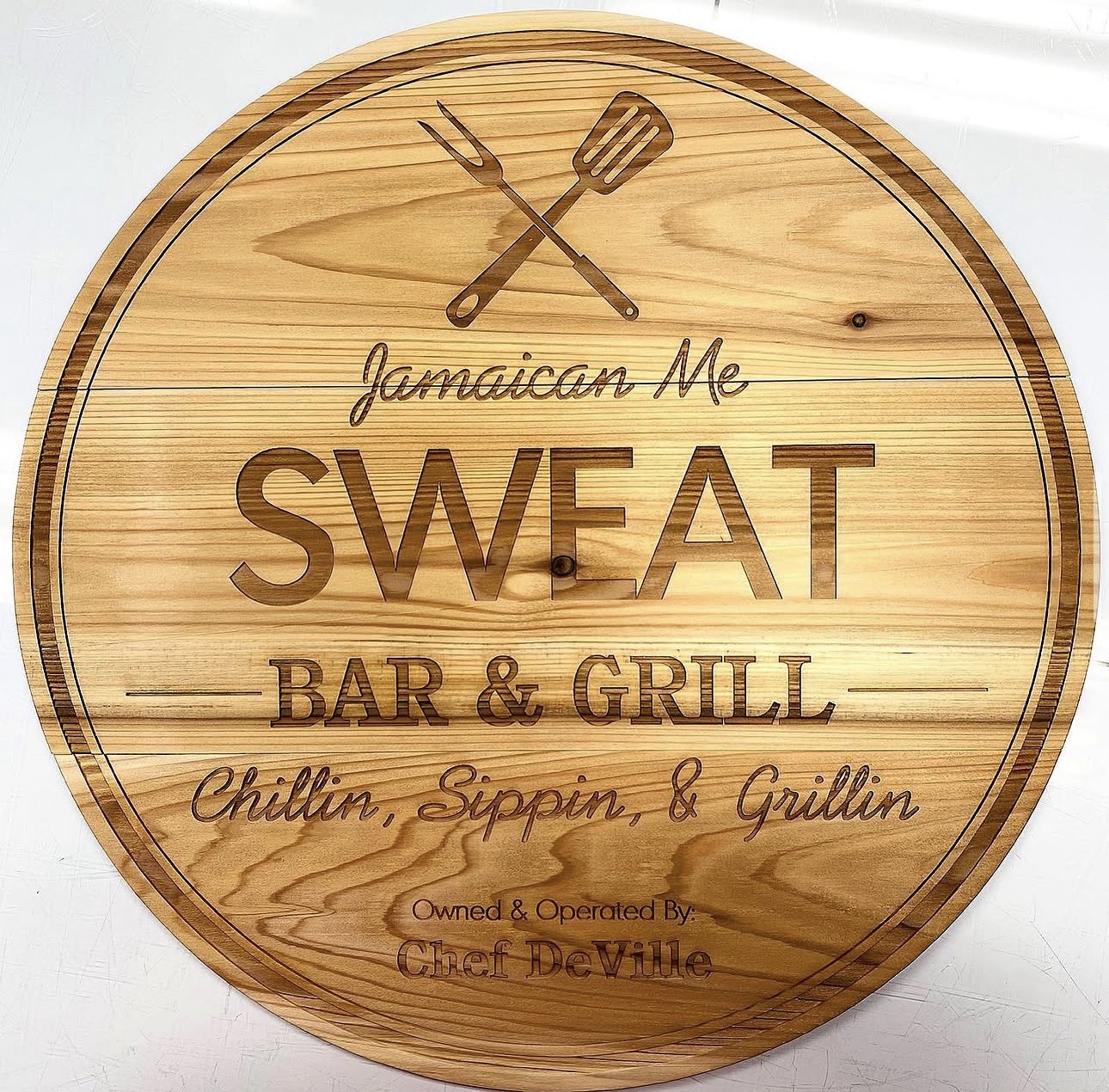 Jamaican Me Sweat Bar & Grill wooden sign