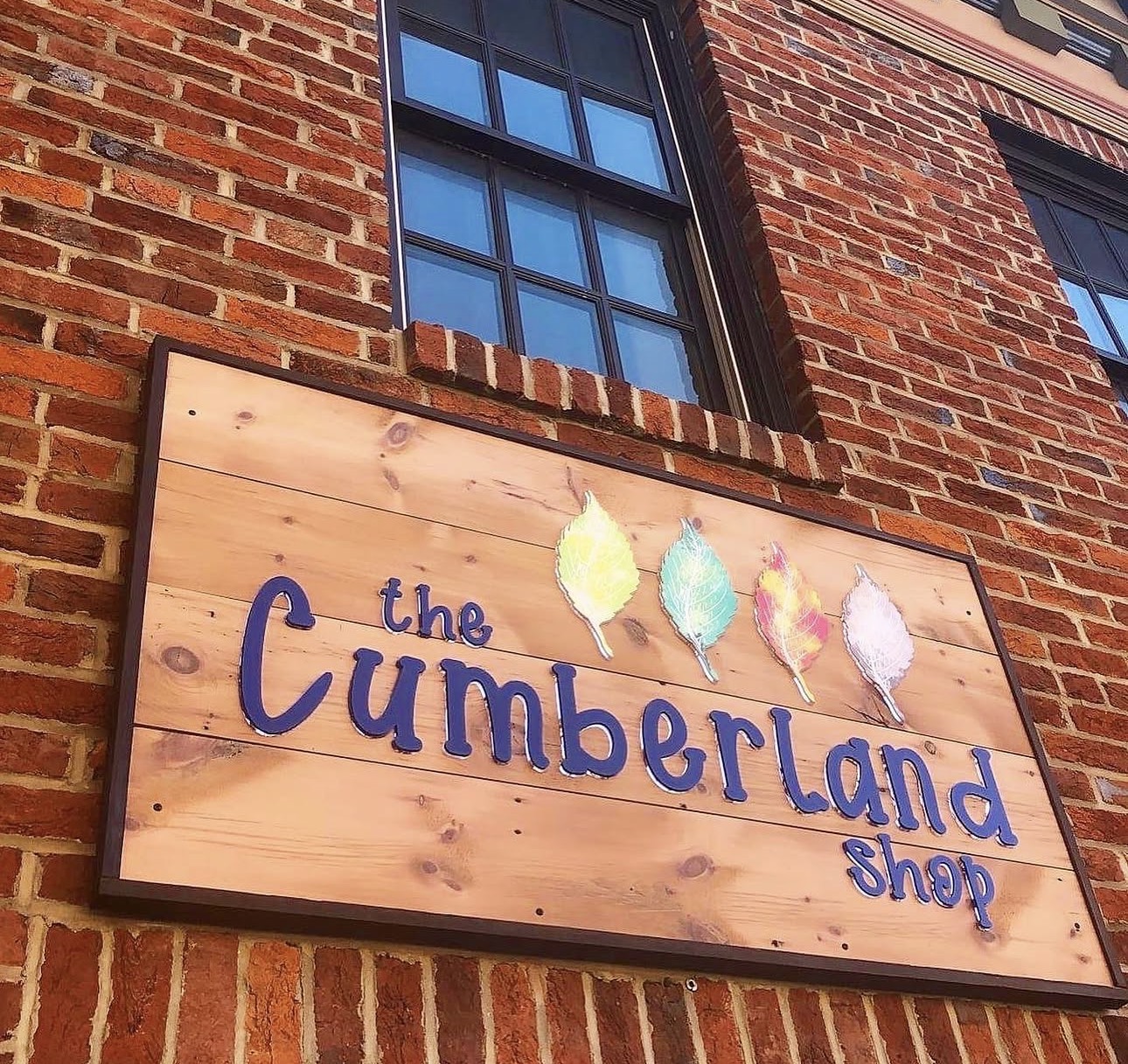 The Cumberland Shop wooden storefront sign