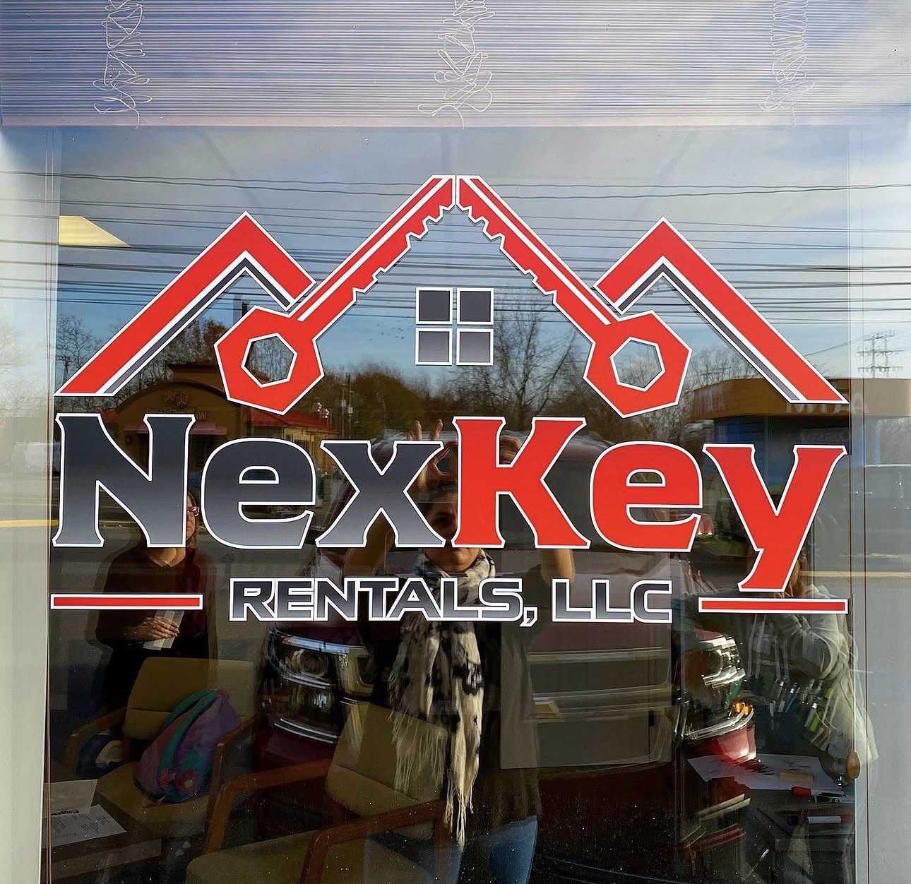 NexKey Rentals, LLC window lettering and logo