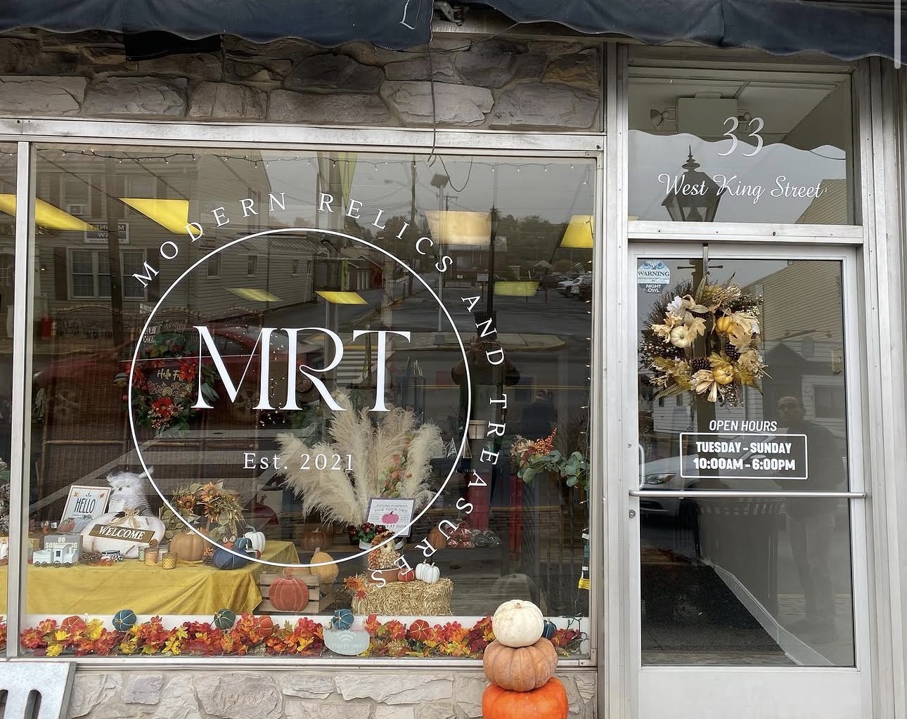 Modern Relics and Treasures storefront window lettering